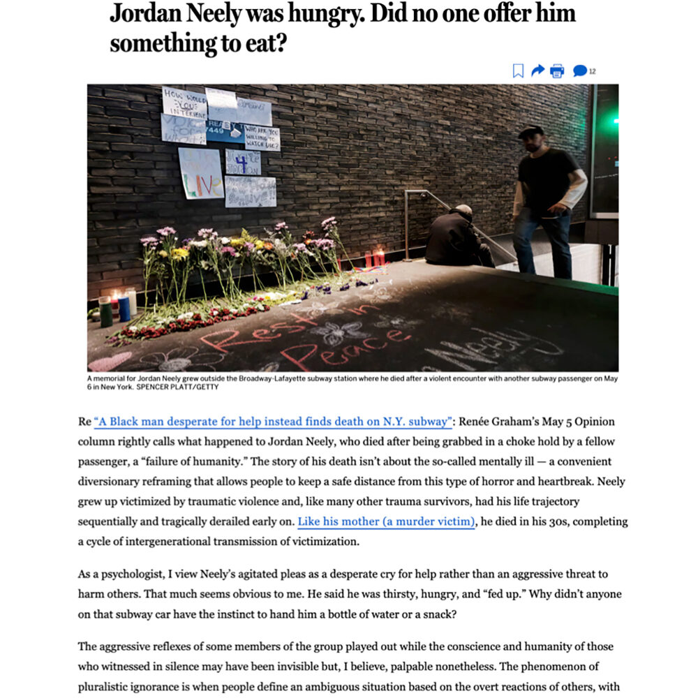 A memorial with flowers and signs for Jordan Neely, surrounded by people reflecting on his tragic death.